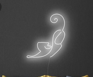 Bella received a neon cat sign cuz she gracious like that, from Ester.