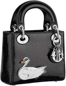 Lucy received a Lady Dior Jewelled Swan bag from Travis.