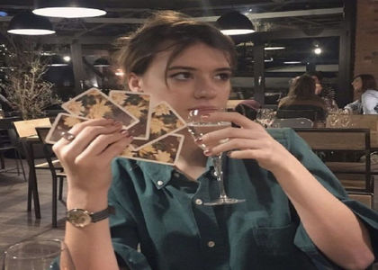 Playing cards with Genesis between takes.; Season 3.
