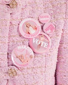 Breaking the glass ceiling and leading with conviction!; Accessorize your political enthusiasm like a true fashionista with our “Margot for Prez” badge designed by my favorite visionary artist of the decade, Francis Braque. It‛s time to vote in style! 
X, M
