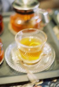 Drink your tea before it gets cold. It will cool you down.