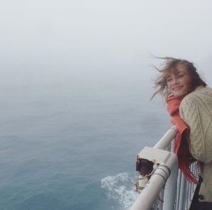 See? My hat would have been a help against the raging Sea of the Hebrides,; but she’s determined not to wear it.
