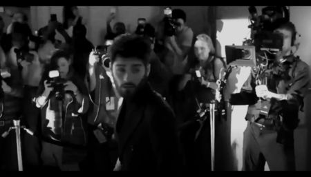 He looked directly at the reporter—head slightly tilted, Zade’s gaze cool and unwavering.; One step forward, and the man holding the microphone instinctively stepped back. Zade said nothing. Just smiled.
