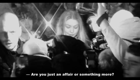 The endless lights of the blitzes exploded in bursts, blinding, and voices rose above the busy; traffic.
