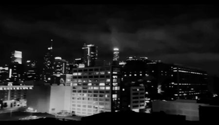 from the inevitable futures that had been carved out for them long before they had any say; in it. Zade stood near the edge, one hand wrapped around a glass of scotch, the other resting on the cold steel railing. Below them, the city sprawled out in a sea of flickering lights, as

