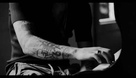 watching him.　⸺ Zade is at the piano. It’s something she’s only seen him do a handful of times—; his fingers moving across the keys in that effortless way of his, like he isn’t really thinking about it, like the music just flows from him, raw and instinctive.
