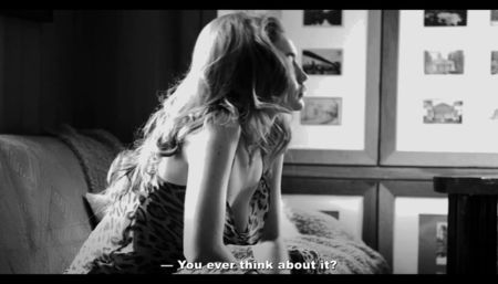 She laughs, shaking her head. ⸺ For a while, neither of them speaks. The fire crackles, the; song changes—something lighter, softer, familiar in a way she can’t place.
