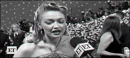 ⸺I take my glass of champagne and join the others, I take a sip of it and smiles to the paparazzi.