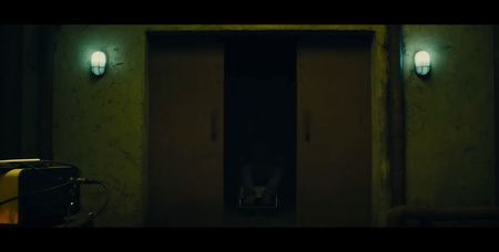 The red button glows faintly in the dark as the last echo of static fades. Everyone’s breathing; fills the silence—shallow, terrified, disbelieving. Then, a sound. A low mechanical whir, followed by a groan of shifting metal. The gurney retracts into the floor, taking the body with it. The blood 
