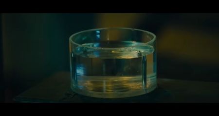 “Seven antidotes. But only six are real. Choose carefully who deserves to live—and who you’re; willing to poison.” Seven syringes eject from the wall, marked only with Roman numerals I–VII. Each person’s wrist tag glows faintly—their numbers matching those markings.
