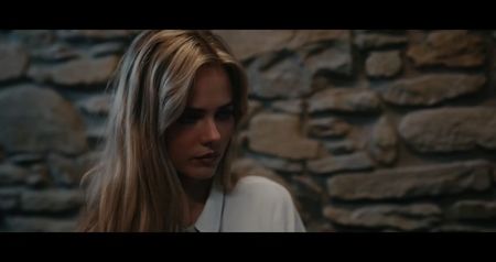 The antidote vial rolls from her hand, empty but useless. She claws at her throat, gasping, foam; spilling from her lips. The group watches, paralyzed—each of them afraid to touch her, afraid to prove they might be next.
