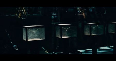 containing something glittering inside—money, jewelry, gold watches, designer cufflinks. The; remnants of their past lives. The voice buzzes overhead: “Welcome to the dispensary. In this room, your medicine is greed. Take too much, and you’ll overdose. Take too little, and you’ll die of
