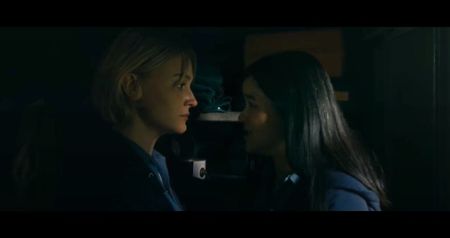 Sylvia looks at the jewelry, one piece resembling the pendant she once stole.