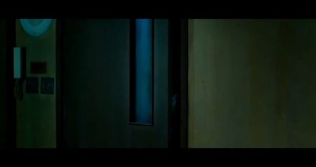 The corridor feels different. Colder. The walls are padded with torn fabric, remnants of isolation; cells. The faint sound of something metallic clanging in rhythm echoes through the hall—steady. At the end of the corridor, the remaining survivors find a steel door with a single word
