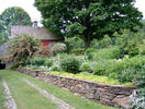 organic-garden-stone-wall-flowers