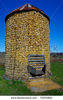 stock-photo-corn-crib-a-wire-mesh-corn-storage-bin-is-filled-to-the-top-after-fall-harvest-73895854