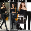 kendall jenner in black off shoulder top black jeans black ankle boots black bag heathrow airport lo