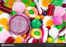depositphotos_154054600-stockafbeelding-kleurrijke-snoepjes-en-gelei-achtergrond