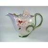 Harry received a flower-shaped teapot from Gizi.