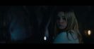 Margot freezes. The others back away. A steel door slides open, leading into a narrow corridor lit