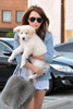 Miley+Cyrus+holds+fluffy+white+puppy+while+EhVC6H-9prym