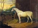 A-Gray-Arab-Mare-Outside-A-Stable-In-An-Extensive-River-Landscape