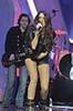 miley-cyrus_COM_PerformingfortheQueenofEngland_7Dec2009_07