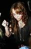 miley-cyrus_COM-hollywood2008oct15-edhardlyfashionshow0012
