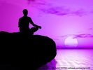 young-boy-in-meditation-position-practicing-yoga-with-violet-sunrise