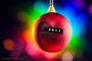 8317000-christmas-ball-with-2011-title-and-multicolor-background[1]