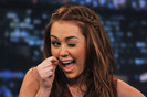 Miley Cyrus Celebrities Visit Late Night With Jimmy Fallon - March 3, 2011