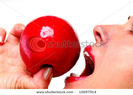 stock-photo-close-up-female-lips-with-red-lipstick-and-bright-red-apple-10697914
