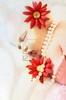 8913889-beautiful-newborn-baby-girl-with-flowers-and-pearls-layers-property-of-photographer