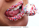 stock-photo-a-woman-mouth-with-colored-candy-36166375