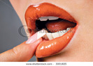 stock-photo-beautiful-orange-lip-with-expressive-gesture-3001825