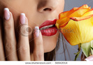 stock-photo-close-up-of-lower-part-of-girl-s-face-with-yellow-rose-56942014