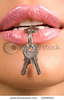 stock-photo-close-up-of-woman-s-lips-with-keys-10908634