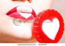 stock-photo-close-up-of-young-beautiful-girl-with-candy-56380057
