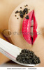 stock-photo-detail-of-woman-with-black-caviar-73530526