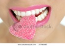 stock-photo-heart-shape-candy-on-beautiful-woman-macro-mouth-37780987