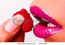 stock-photo-lips-and-a-raspberry-close-up-16941994