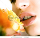 stock-photo-lips-with-flower-10453159