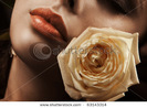 stock-photo-portrait-of-a-young-beauty-with-rose-63143314