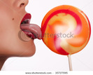stock-photo-portrait-of-sexy-tongue-licking-lollipop-isolated-on-white-35727595