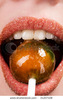 stock-photo-pretty-girl-lips-sucking-lollipop-closeup-31207108