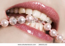 stock-photo-sparkling-lips-white-teeth-and-pink-pearls-28500130