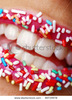 stock-photo-womans-lips-with-colored-candy-48739978