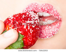 stock-photo-young-woman-s-mouth-with-red-strawberry-covered-with-sugar-72612253
