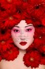 stock-photo-beautiful-young-asian-girl-with-stylish-make-up-and-red-flowers-around-face-51213631m