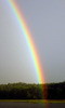 Rainbow_above_Kaviskis_Lake,_Lithuania